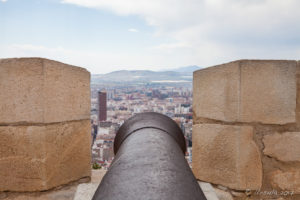 View over a canon to Alicante from Santa Bárbara Castle, Alicante, Spain