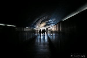 People silhouetted in a corridor against the light, Santa Bárbara, Santa Bárbara Castle, Alicante, Spain