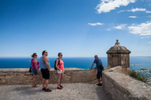 Tourists looking out from Castillo de Santa Bárbara, Alicante Spain