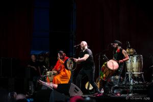 N'Faly Kouyate, Robbie Harris and Johnny Kalsi (Afro Celt Sound System) on stage at Byron Bay Bluesfest 2018, AU
