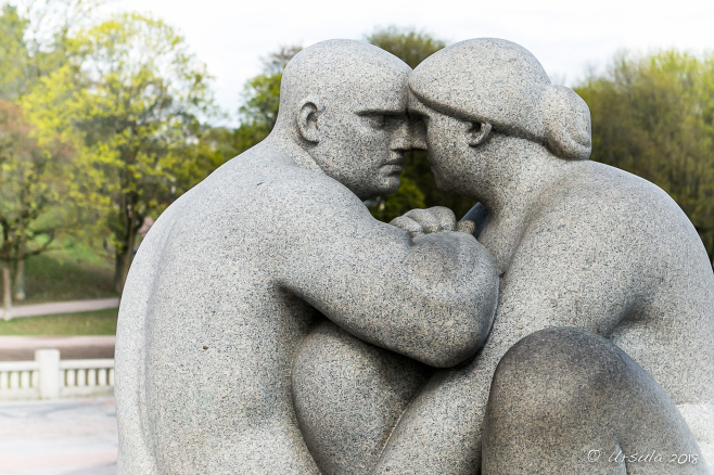 White stone statue of an intimate couple, Vigeland installation in Frogner Park, Oslo Norway