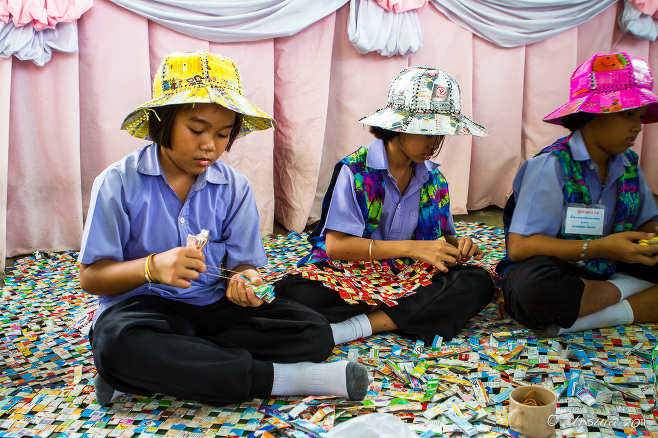 Thai Schoolgirl making Recycle Hats, Bang Khun Thien Thailand.