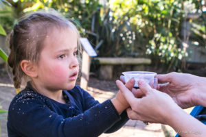 Young girl holding bird feed, Asia-Pacific walk-in aviary, On the Perch Bird Park Tathra