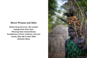 Mursi Woman in a headdress of fruit, feathers and horns, with a Baby, Ethiopia