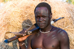 Mursi man with gun, Ethiopia