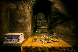 Statue of Ganesha in a dark corner of Elephant Cave, Bedulu Bali
