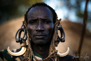 Mursi man in a Nilla Headdress, Ethiopia