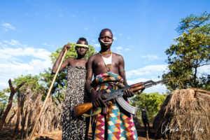 Mursi Men with a Staff and a Gun, Ethiopia