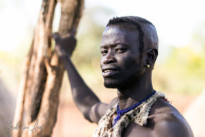 Mursi man in a patterned, shaved haircut, Ethiopia