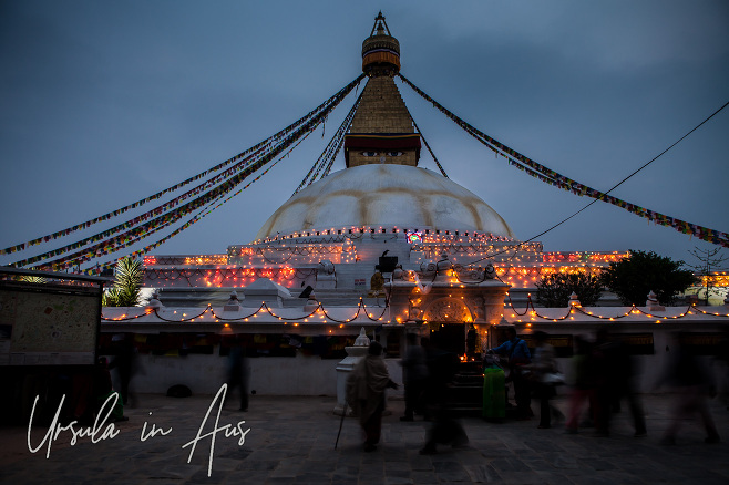 People walking around Boudhanath Stupa, kathmandu before dawn.