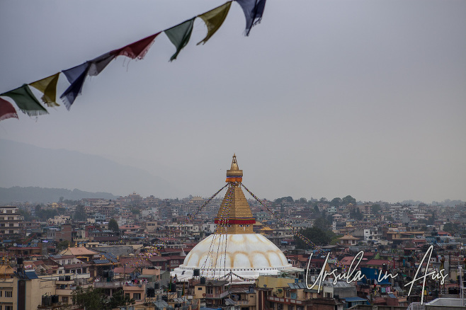 Boudhanath Stupa over the rooftops of Boudha, Kathmandu Nepal.