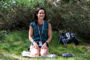 Woman kneeling, on Dead Horse Gap track, Kosciuszko National Park, Australia