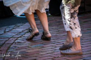 Dancing women's feet on pavers, Poolside, Thredbo Blues Festival, Australia