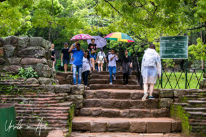 People on the Steps from the water gardens, Sigiriya Sri Lanka