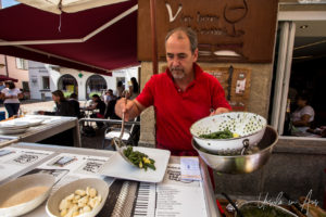 Orlando Lardi making pizzoccheri outside Hostaria del Borgo, Poschiavo, Switzerland