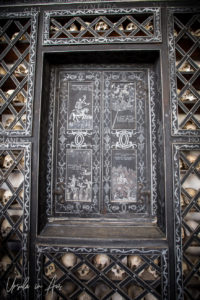 Chalk drawings and skulls on shelves, Oratorio Sant'Anna with ossuary, Poschiavo Switzerland