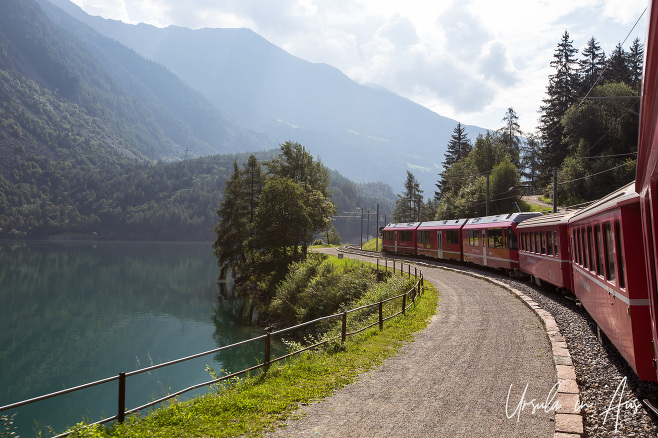 Bernina Express alongside the Lago di Poschiavo, Switzerland