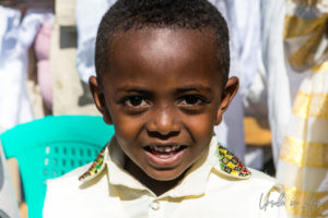 Smiling Ethiopian boy, Entoto Maryam Church, Addis Ababa