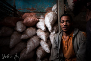 Man in the potatoes, vegetable market, Addis Ababa Ethiopia