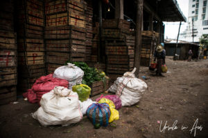 Bags of produce in a dirt-floored vegetable market, Addis Ababa Ethiopia