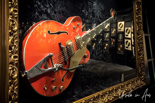 Orange guitar in a gold frame, Musicians Hall of Fame and Museum, Nashville