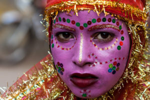 Child in pink face paint, Pushkar India