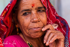 Older Indian a Woman in a red headscarf, Pushkar