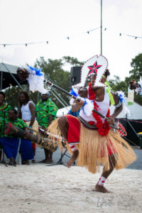 Malu Kiai Mura Buai Warrior in headdress, Buai dancer with flowers, Boomerang Byron Bay 2019
