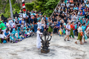 Balinese man in white lighting a giant lantern, Uluwatu, Bali