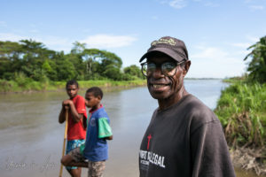 Old Papuan man and two lads on the riverbank, Middle Sepik, PNG