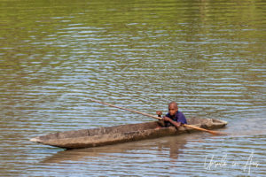 Papuan boy in a Dugout canoe, Sepik River PNG