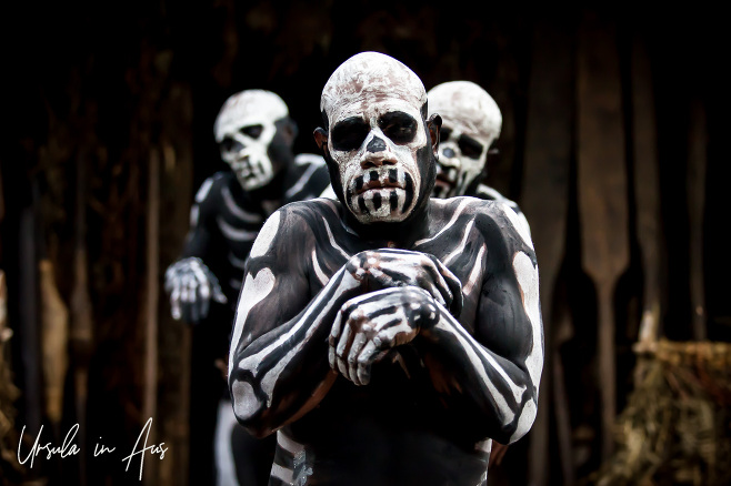 Three Chimbu Skeleton Men of the Bugamo Tribe walking like zombies, Paiya Village Papua New Guinea