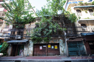 Rusty garage shutters, old Old Yaowarat Street, Bangkok Thailand