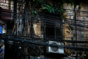 Air conditioning unit on a derelict building, Bang Rak, Bangkok Thailand