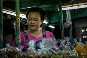 Thai woman selling bags of sweet, Bangkok Thailand