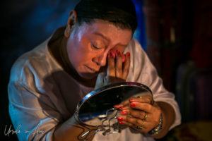 Chinese opera performer applying base makeup, Chao Zhou Shi Kong Shrine, Bangkok