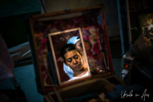 Young woman's face in a mirror, Chao Zhou Shi Kong Shrine, Bangkok