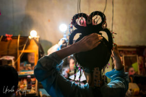 Rear view of a Chinese opera performer fixing her headdress, Chao Zhou Shi Kong Shrine, Bangkok