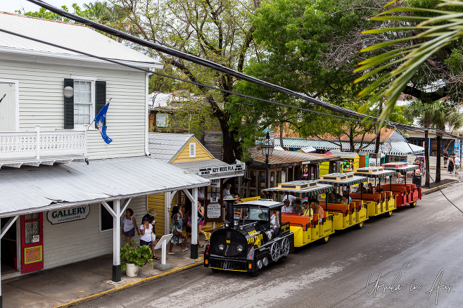 Colourful "Conch Tour Train" on a Key West street, Florida USA