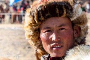Portrait of a Kazakh eagle hunter in a Fox-Fur Hat, Golden Eagle Festival, Olgii Mongolia