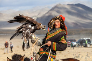 Eagle hunters and golden eagle on horseback, Golden Eagle Festival, Olgii Mongolia