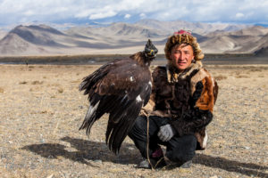 Portrait: Kazakh Hunter and his bird at the Golden Eagle Festival, Olgii Mongolia