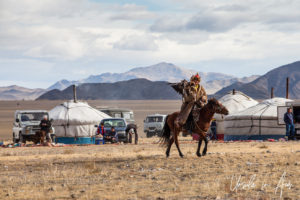 Eagle hunter riding through the gers, Golden Eagle Festival, Olgii Mongolia
