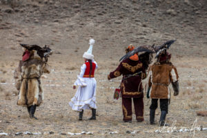 Men and women in traditional Kazakh dress, Golden Eagle Festival, Olgii Mongolia