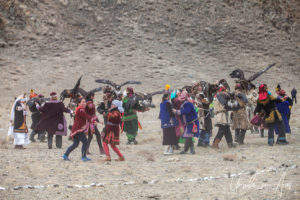 Dancing men and women in traditional Kazakh dress, Golden Eagle Festival, Olgii Mongolia