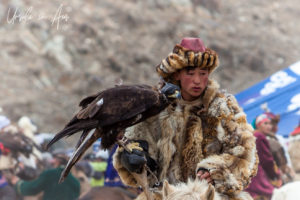 Portrait: Kazakh Hunter and his bird at the Golden Eagle Festival, Olgii Mongolia