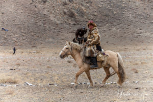 Kazakh Hunter and his bird at the Golden Eagle Festival, Olgii Mongolia