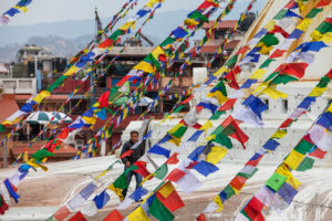 Looking through the prayer flags to Boudhanath stupa, Kathmandu Nepal