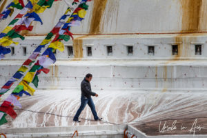 Man walking on a landing, Boudhanath Stupa, Kathmandu Nepal