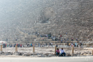 Visitors climbing over the lower levels of the Tomb of Pharaoh Khufu or Cheops, Giza Egypt